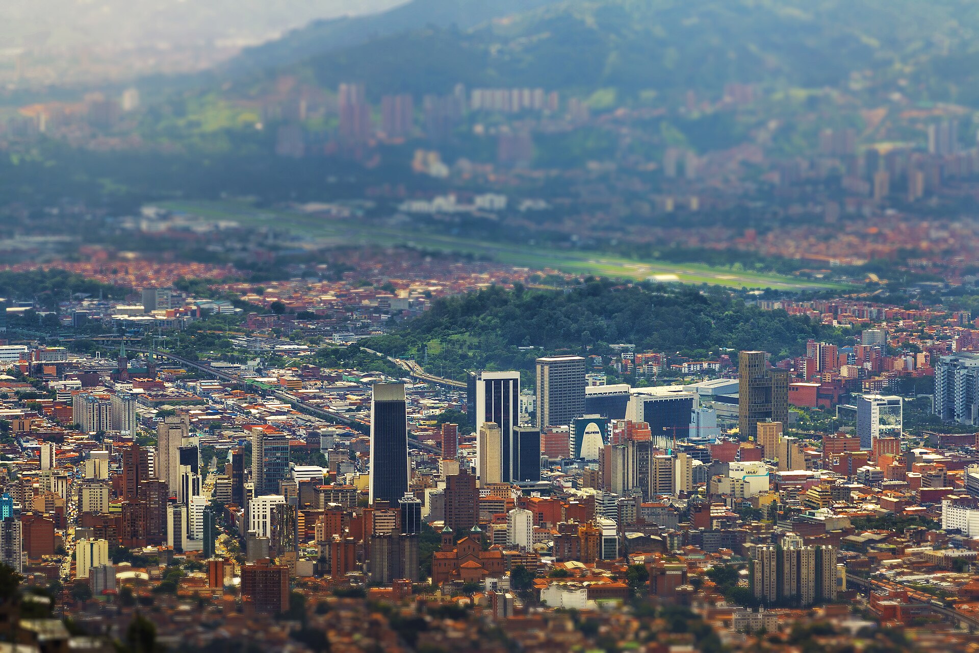 Medellin city buildings surrounded by green mountains