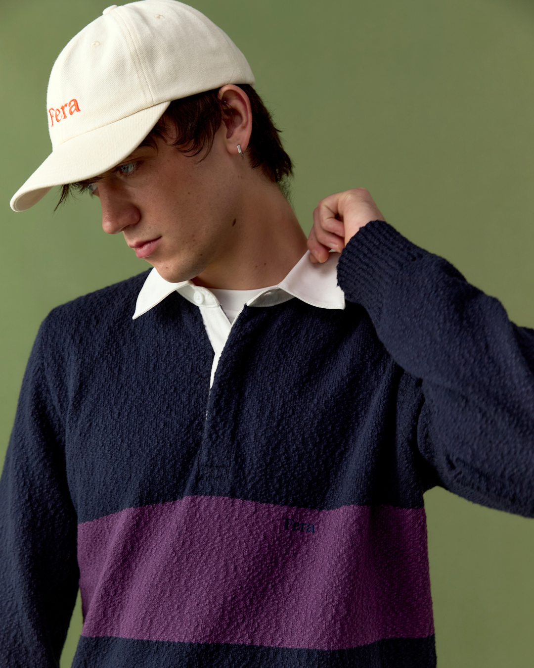 Wide atmospheric shot of misty British fields and a muddy A-road under an overcast sky.