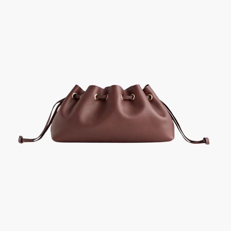 Madewell Drawstring Clutch in a soft, folded leather design.