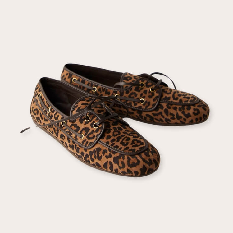 Stylized shot of Free People boat shoes paired with contemporary streetwear.