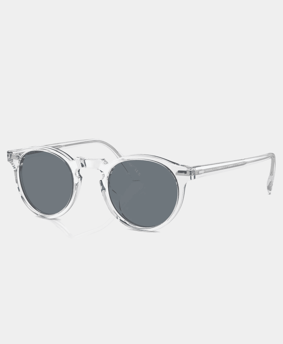 Front view of minimalist clear acetate round frames with gray lenses.