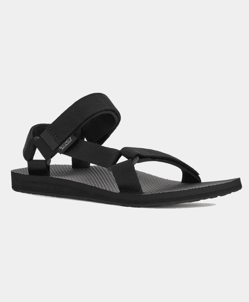 A black Teva sandal with adjustable straps on a white background.