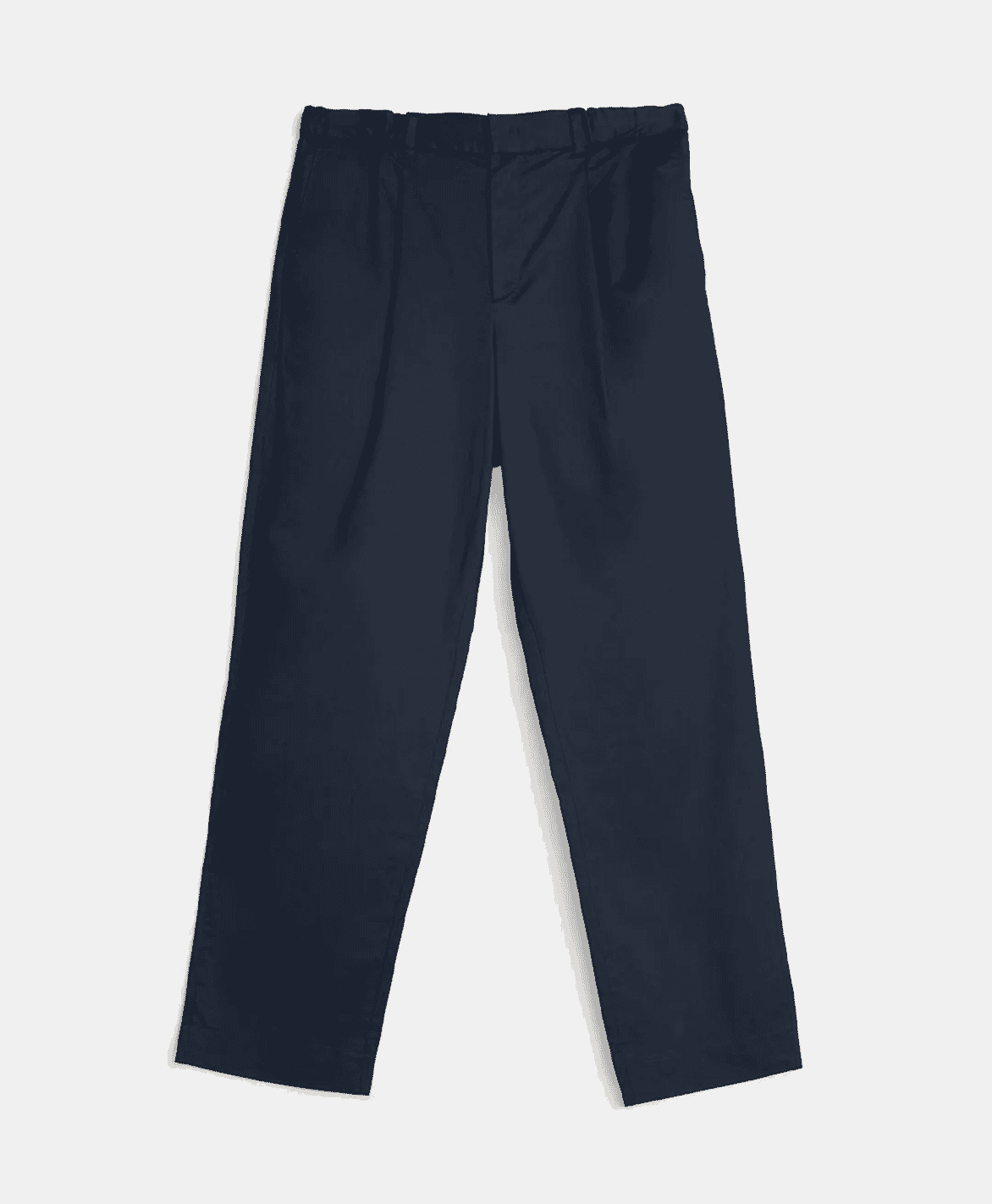 A pair of navy relaxed chino pants styled with white sneakers for a smart-casual look.