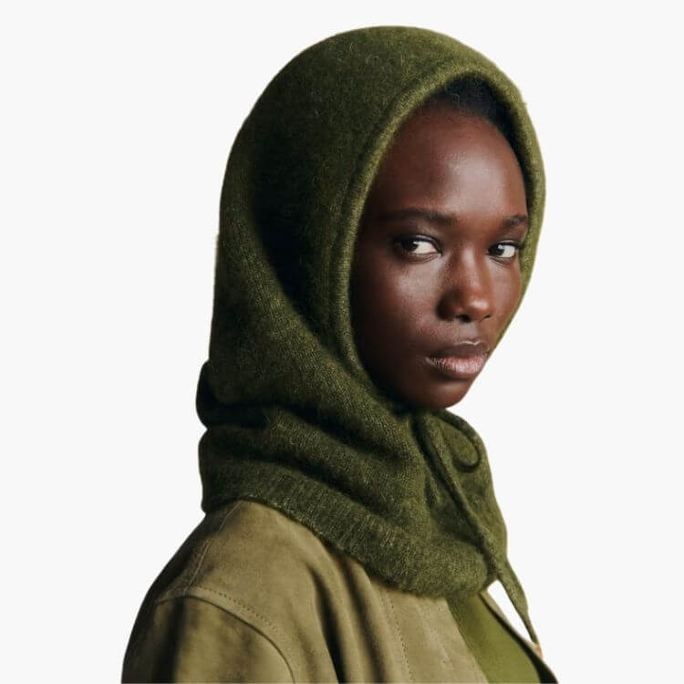 A luxurious knit hooded scarf that drapes over the shoulders.