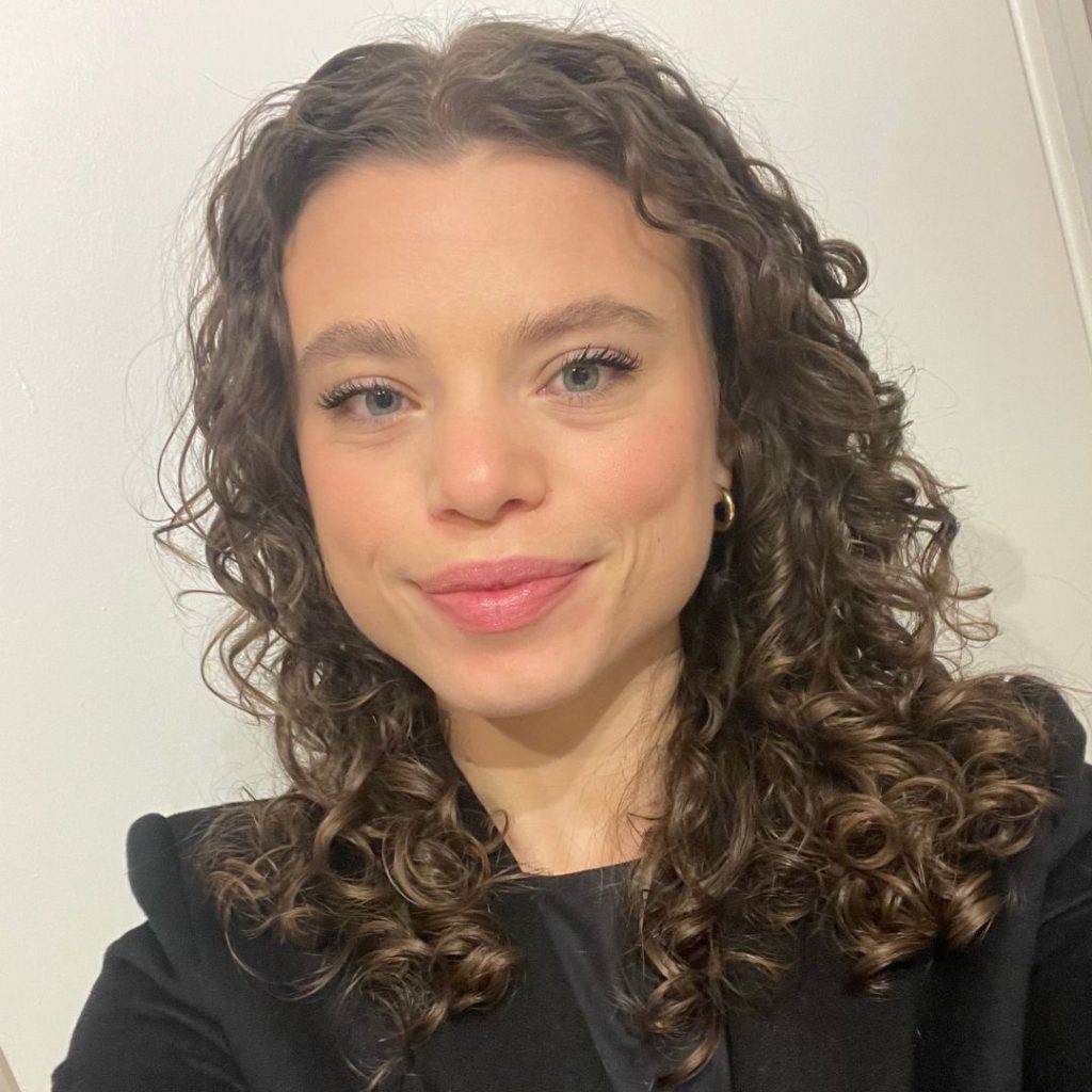 Author with a professional, full face of makeup for a career event