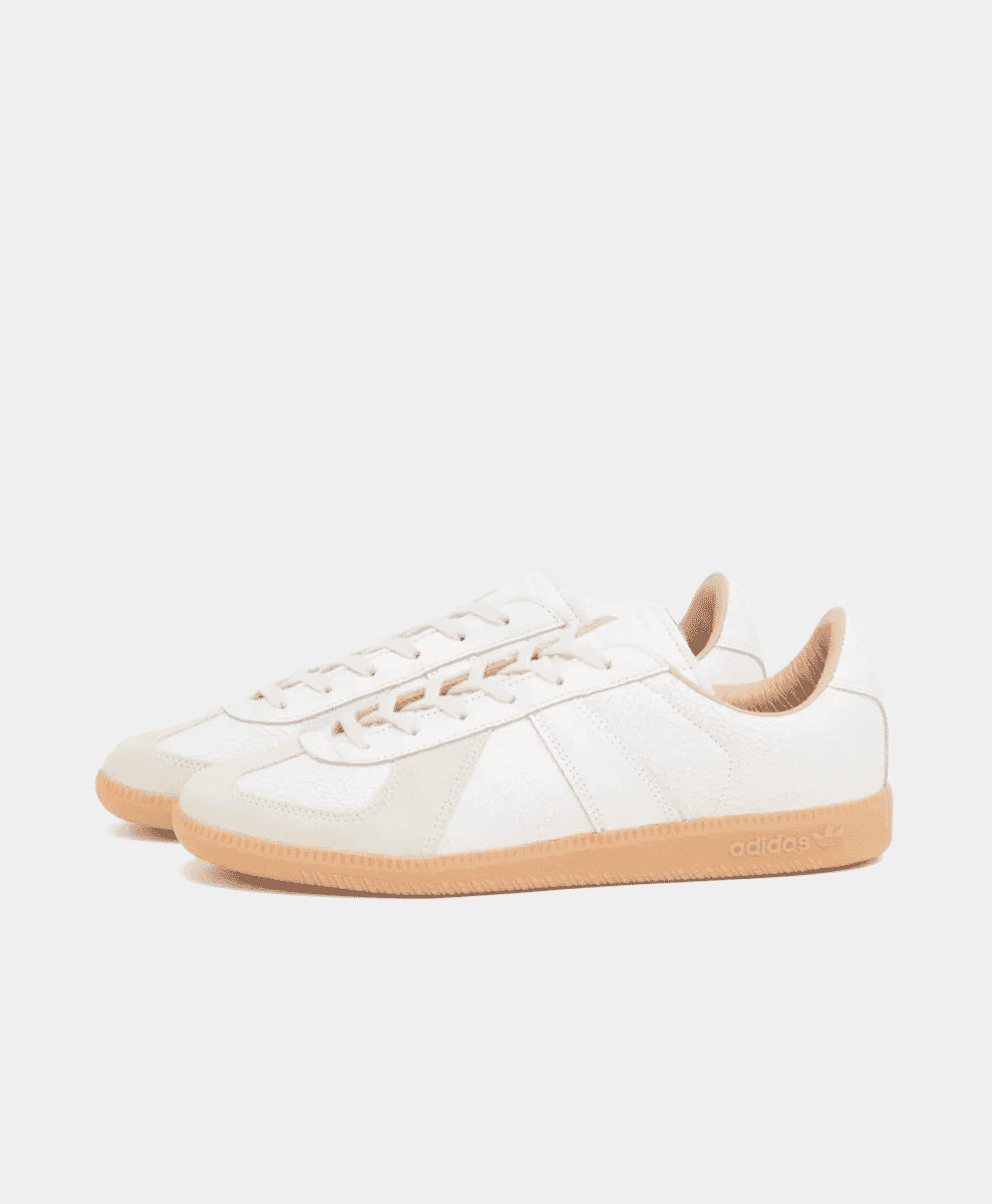 A pair of white Adidas Originals BW Army Trainer sneakers with gum-colored soles.
