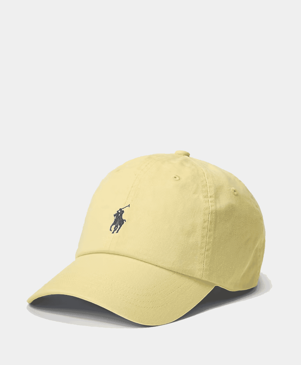 Pale yellow Polo Ralph Lauren baseball cap with a dark blue embroidered polo player logo.