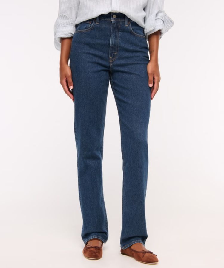 A pair of high-waisted 90s style straight-leg jeans in a classic wash.