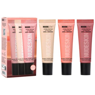 A set of Nudestix Hydra-Peptide Lip Butter Tints in various neutral shades.