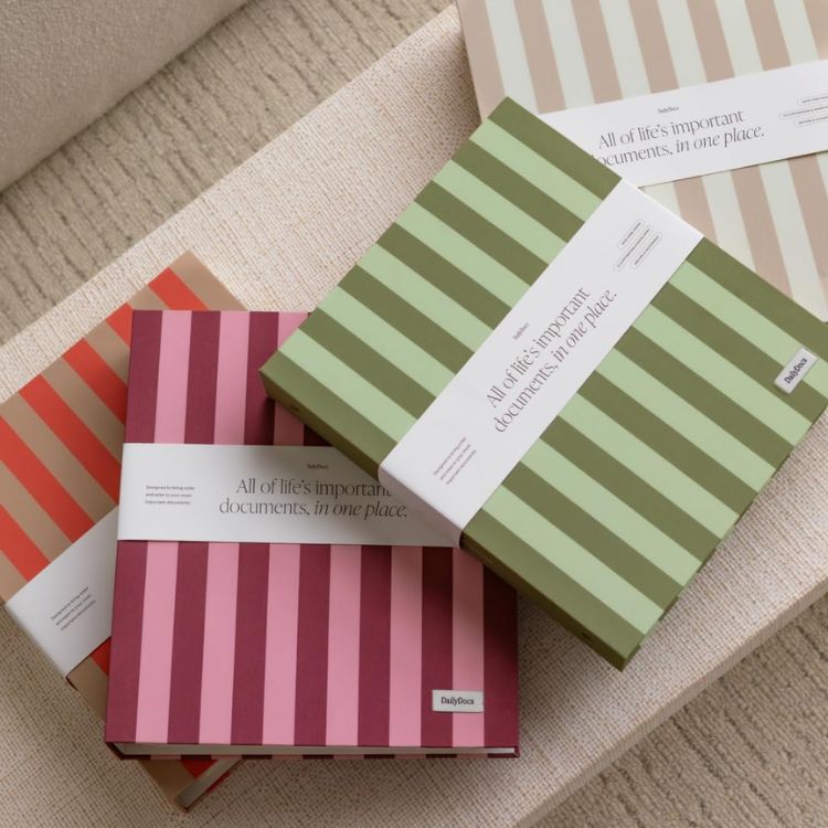 A sleek, neutral-toned document organizer standing on a clean desk surface.