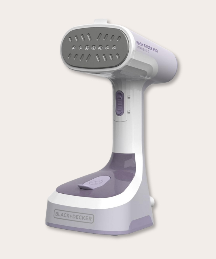 A foldable steamer being used on a garment.