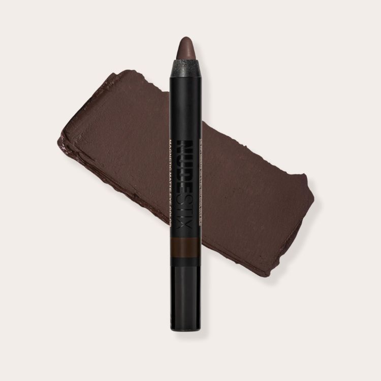 Nudestix Magnetic Eye Color stick in a moody neutral shade.