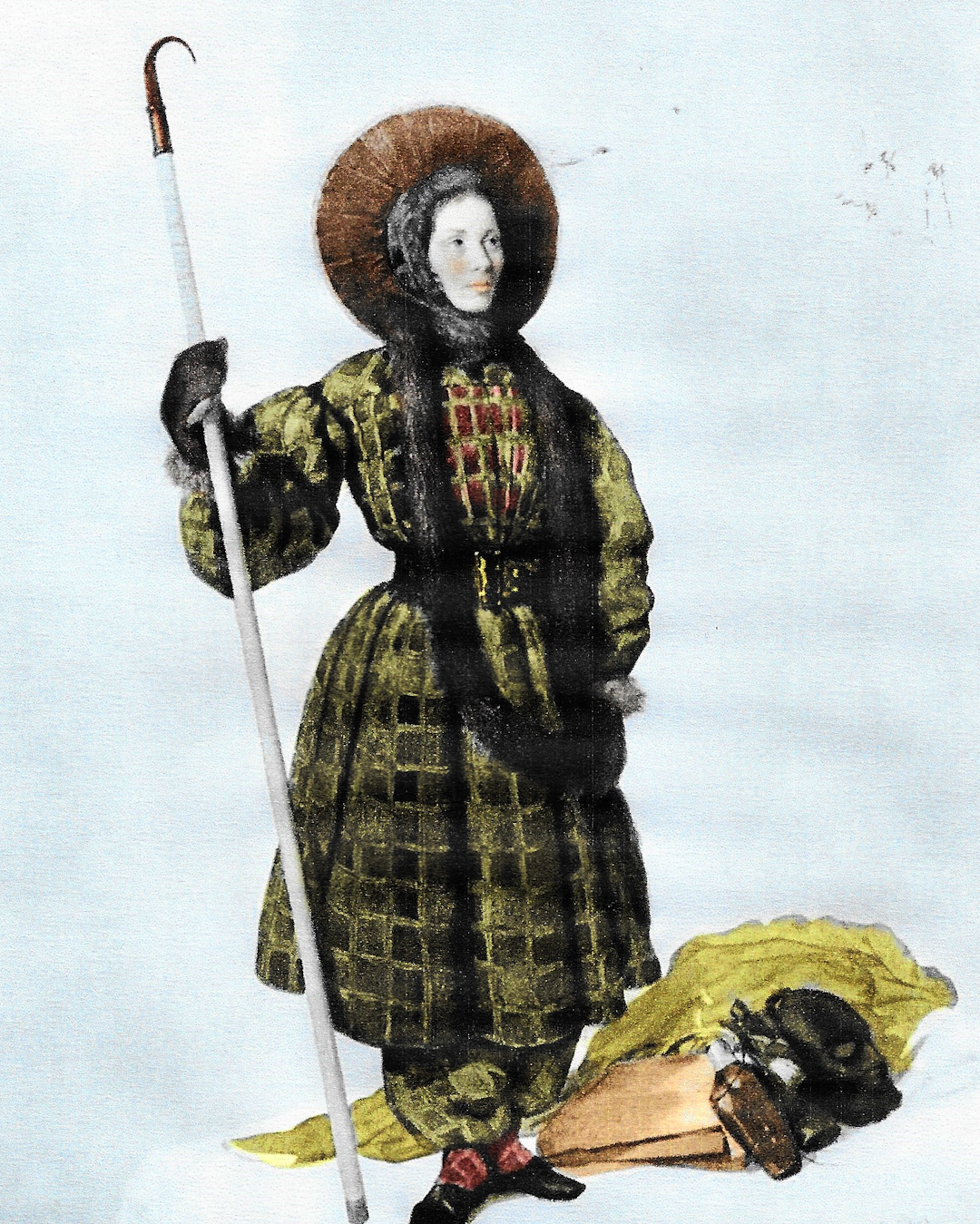 Vintage photograph of a woman wearing a heavy wool skirt and boots while navigating a rocky slope.