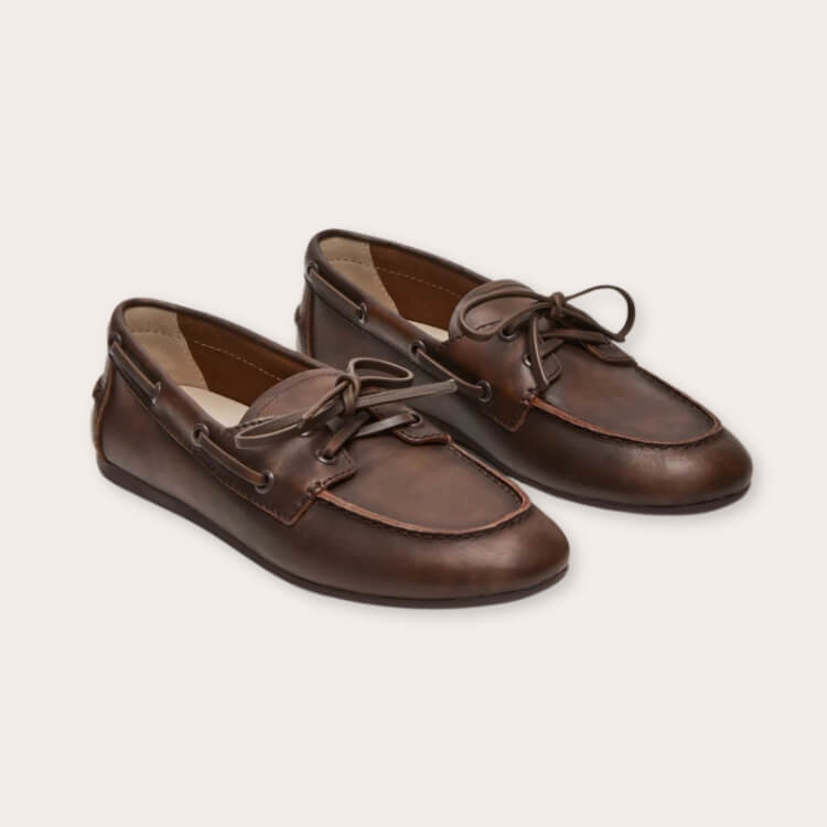 Structured black leather boat shoes by Steve Madden.