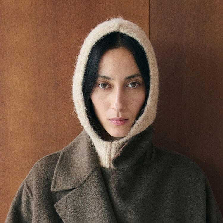 A simple, clean-lined knitted balaclava covering the head and neck.