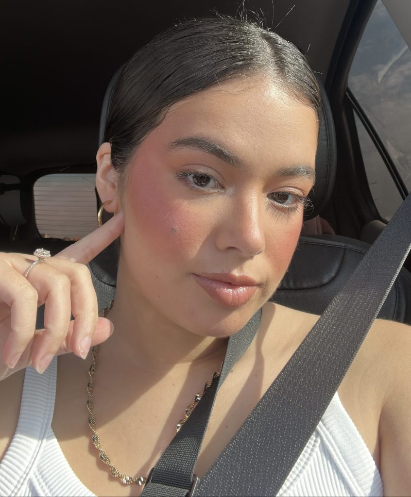 A minimalist flat-lay of medical-grade luxury skincare products on a white surface.