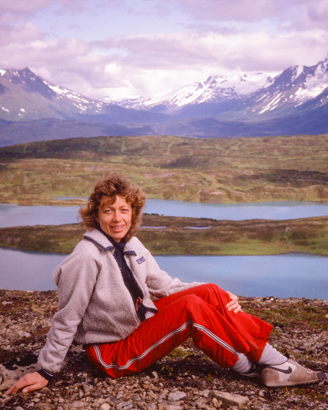 Macro detail shot showing GORE-TEX taped seams and the texture of heavyweight ripstop fabric on an ACG jacket.