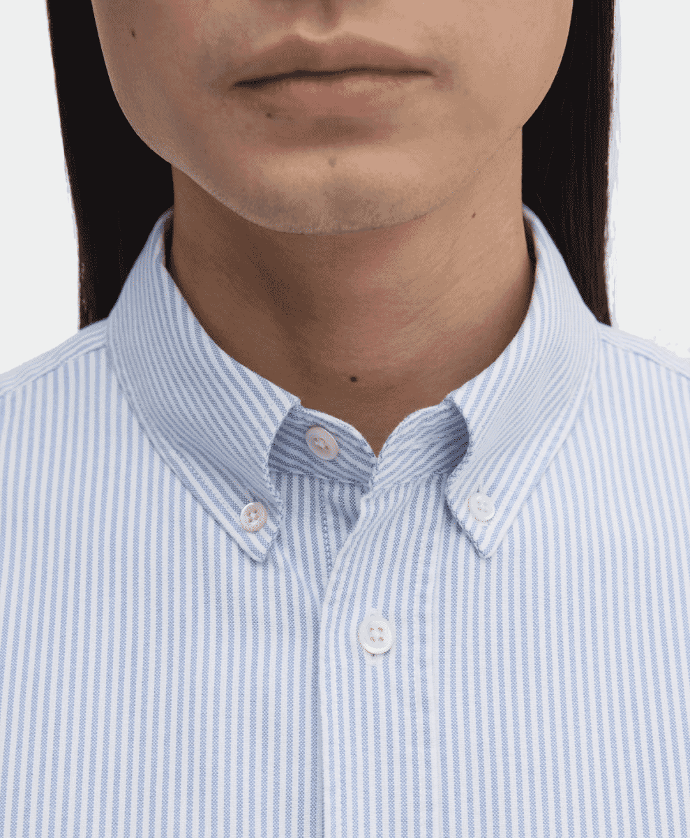 Close-up of a light blue and white striped button-down collar.