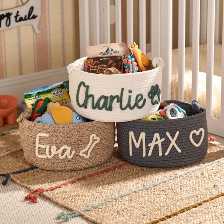 A personalized fabric toy basket with custom embroidery.