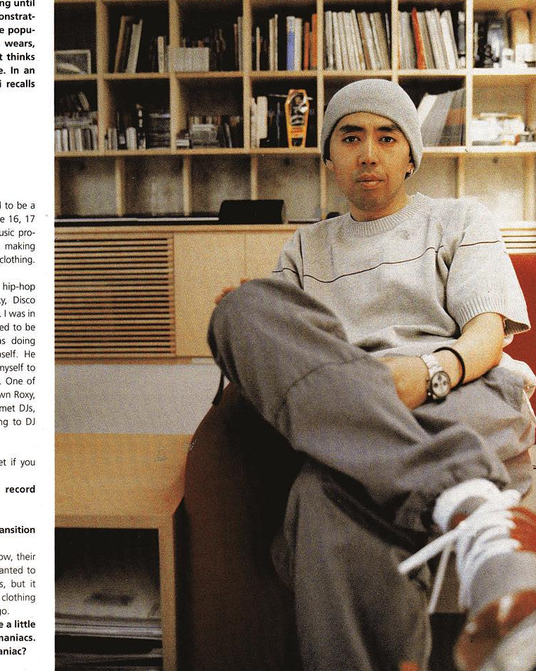 A minimalist, organized collection of rare sneakers and streetwear artifacts in a clean studio setting.