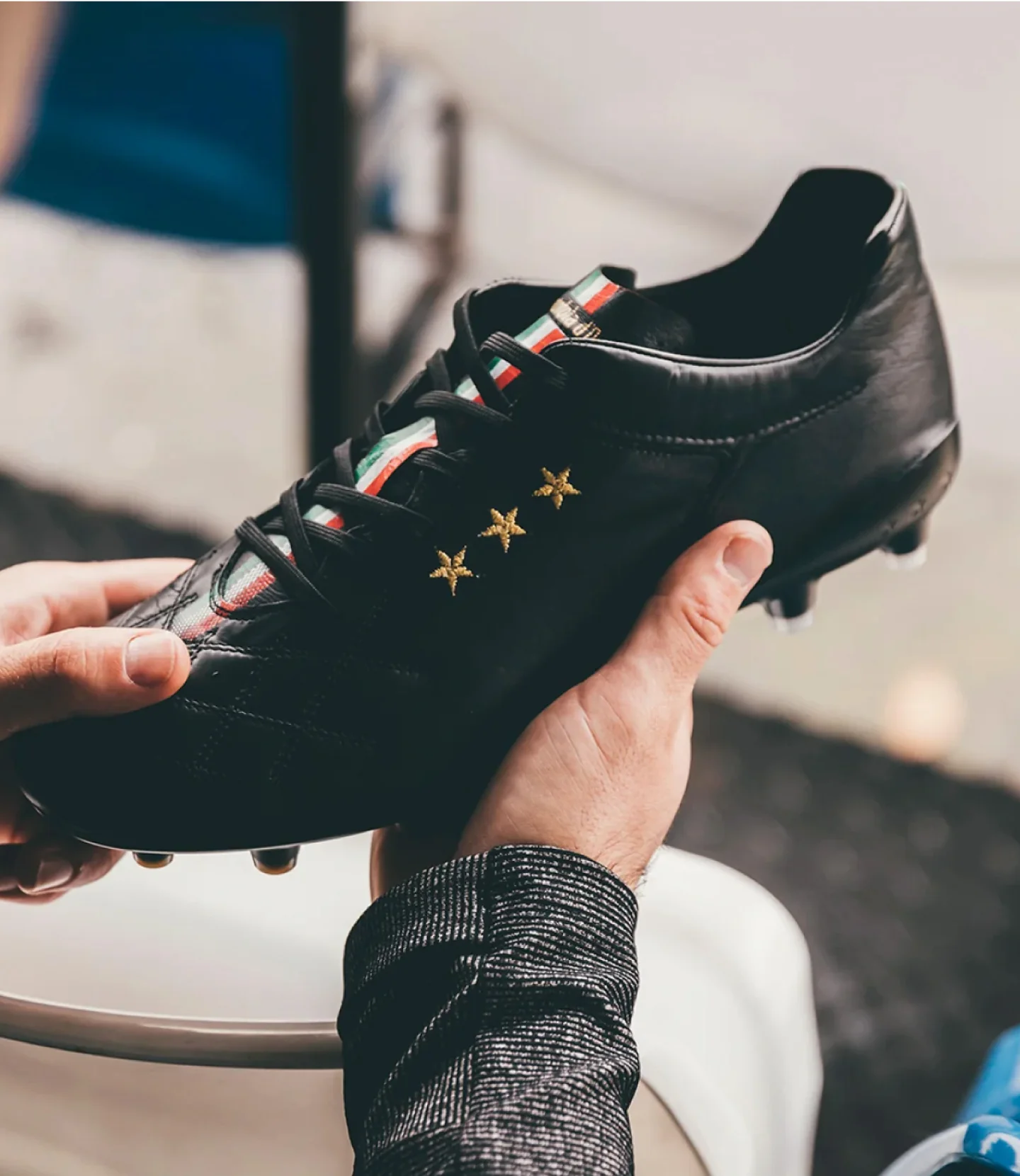 Close-up of a designer collaboration sneaker featuring unique artistic patterns and traditional leather.