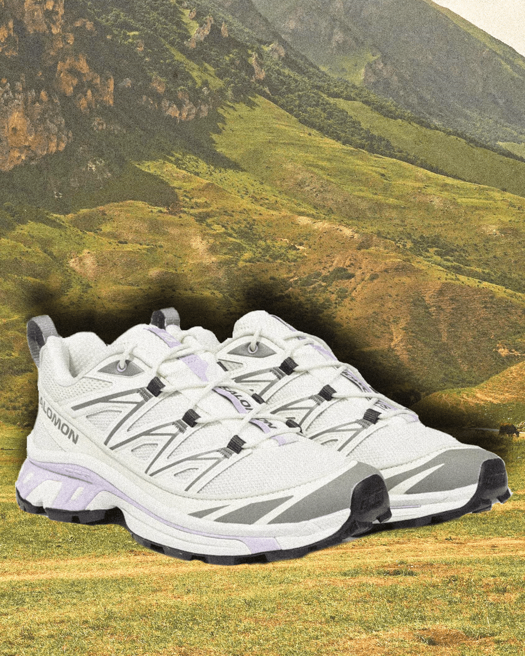 White Salomon Genesis shoes with purple and gray accents.