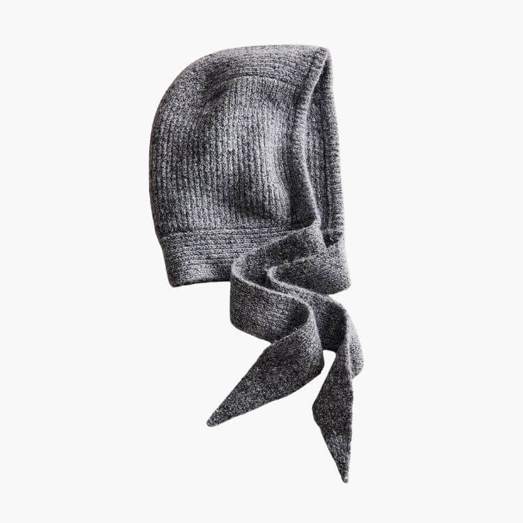 A combination of a balaclava and a bonnet style head covering in a soft knit.