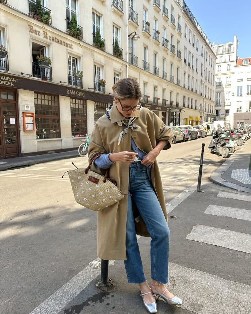 Close-up of gold hoop earrings and subtle jewelry on a woman.