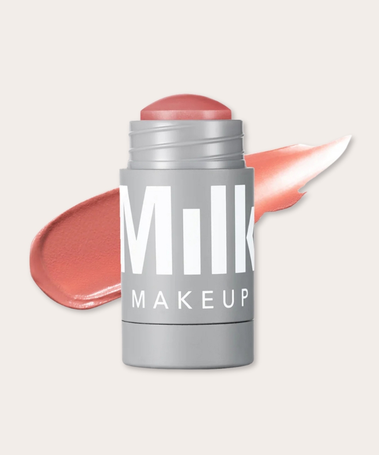 A cream blush stick in a soft pink hue.