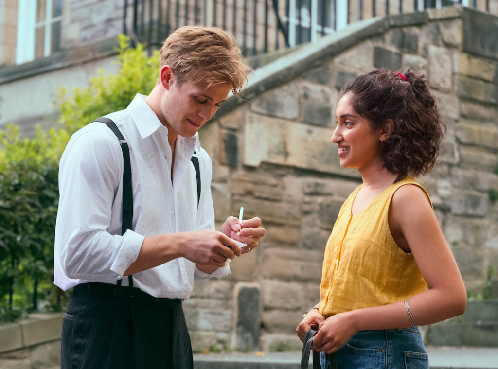 Promotional still of Emma Morley from One Day wearing a yellow tank top.