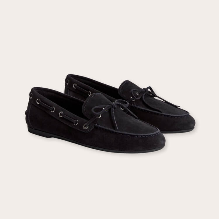 Soft tan suede boat shoes by Everlane.