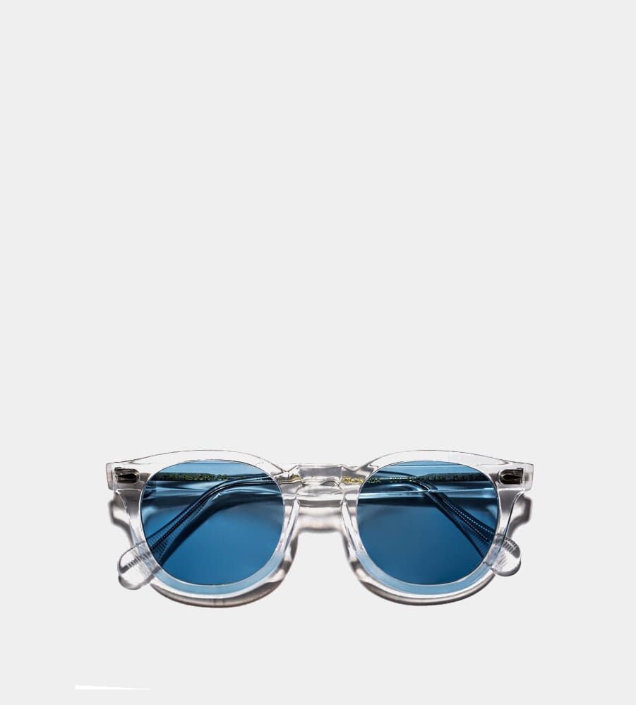Clear acetate sunglasses featuring light blue-tinted lenses.