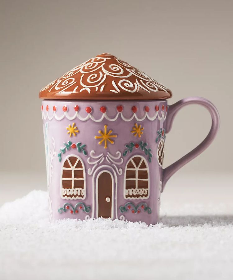 Stoneware mug shaped like a classic gingerbread house.