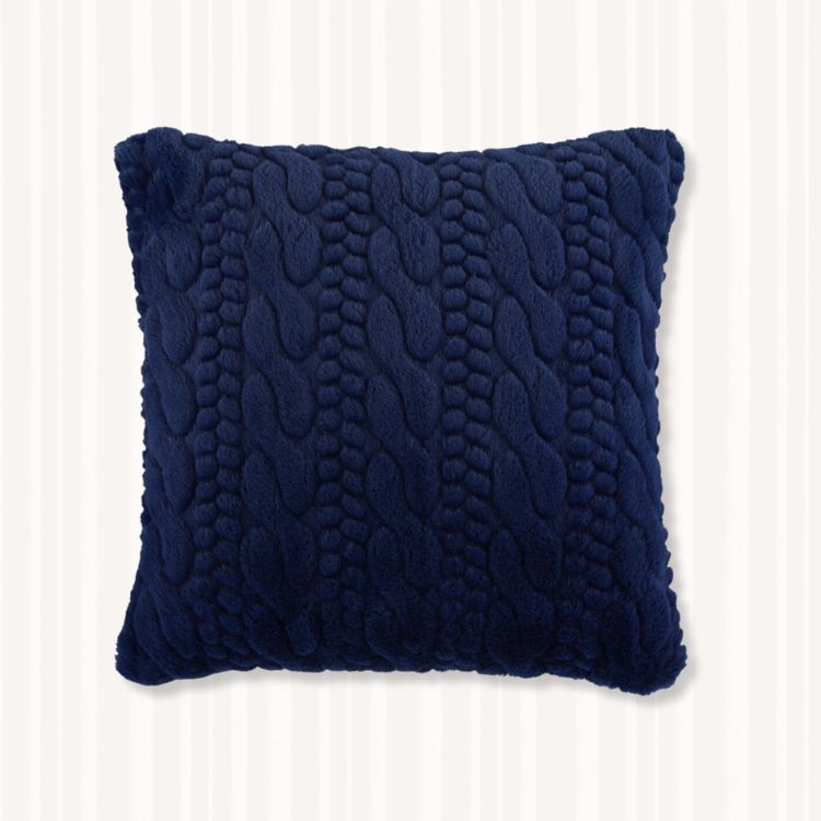 A solid navy blue throw pillow.