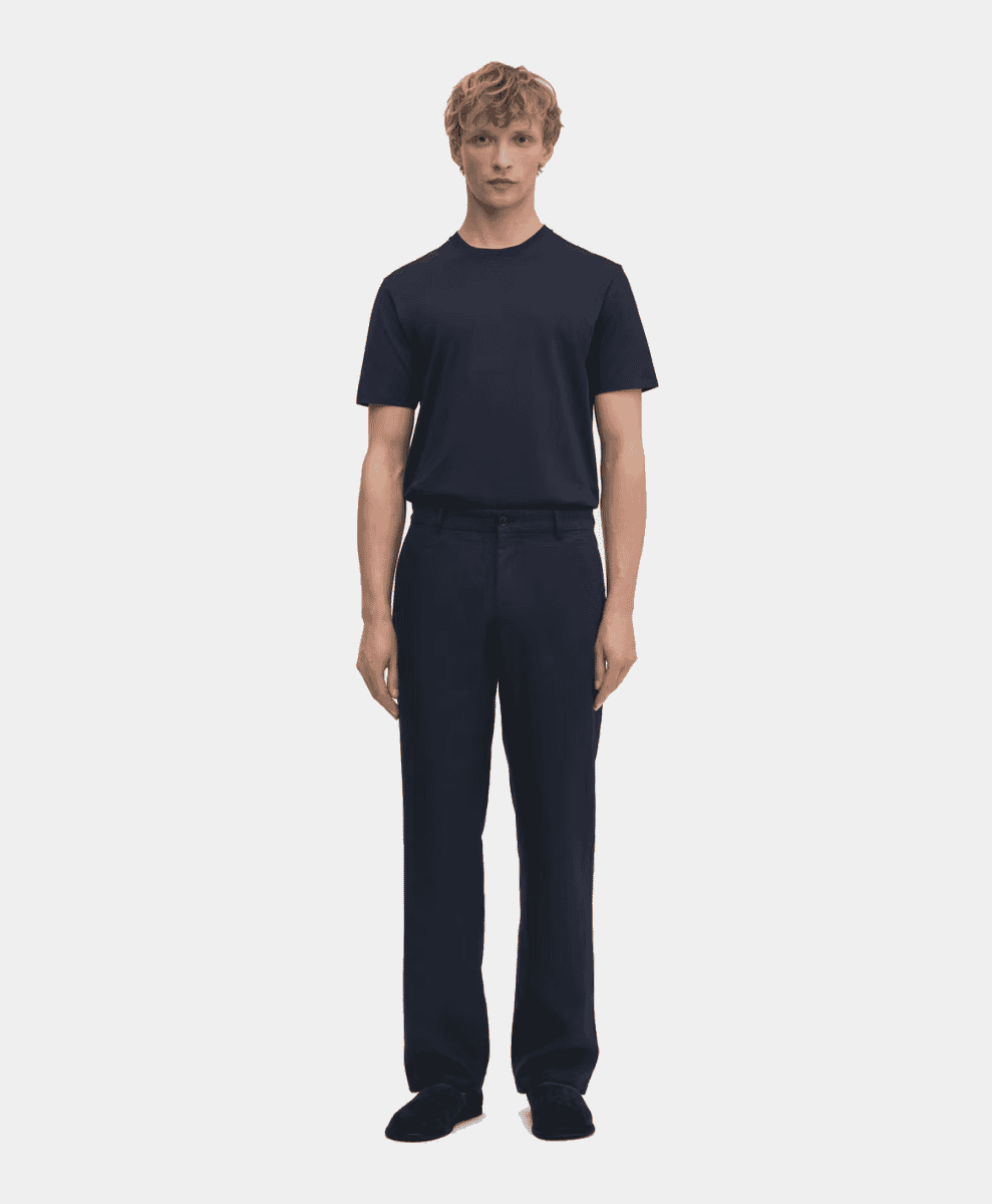ASKET navy linen trousers showing a clean, straight-leg cut