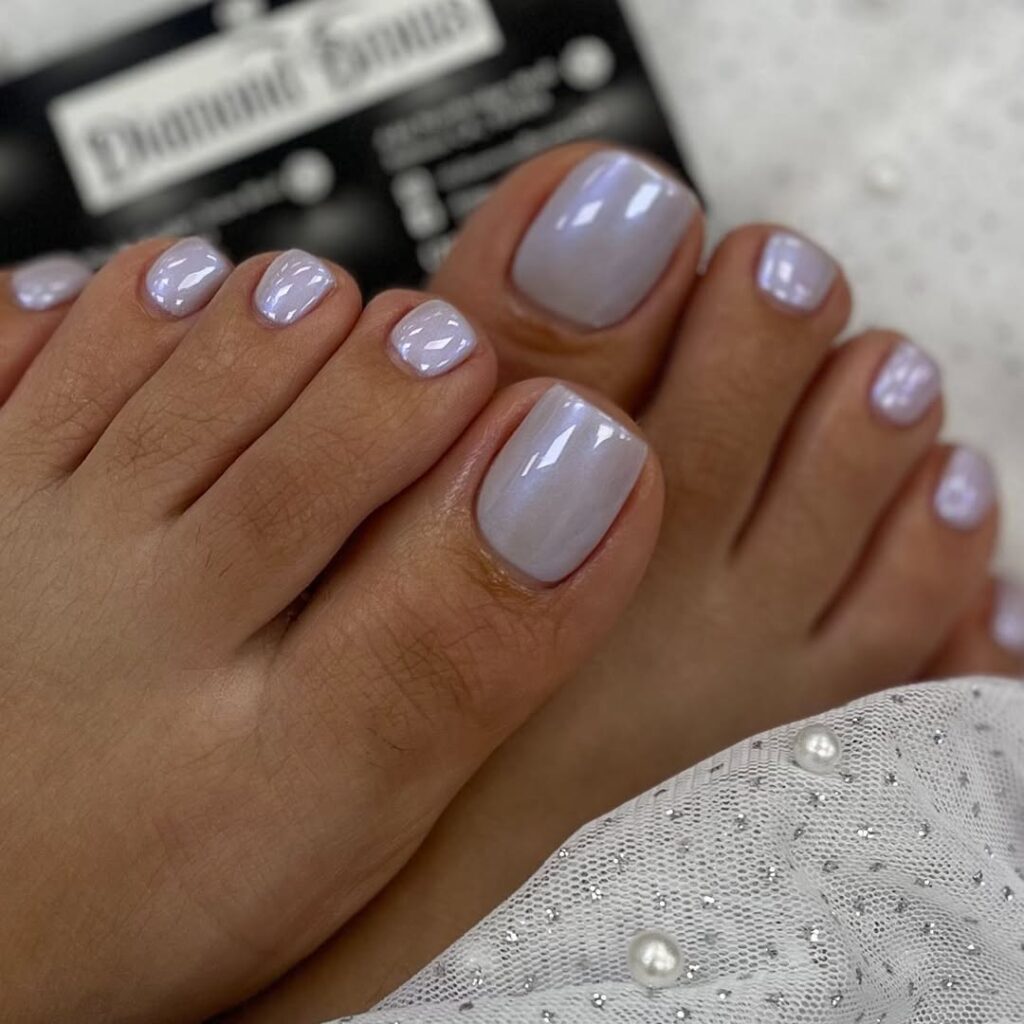 Close-up of silver chrome toe nails showing the molten metal effect.
