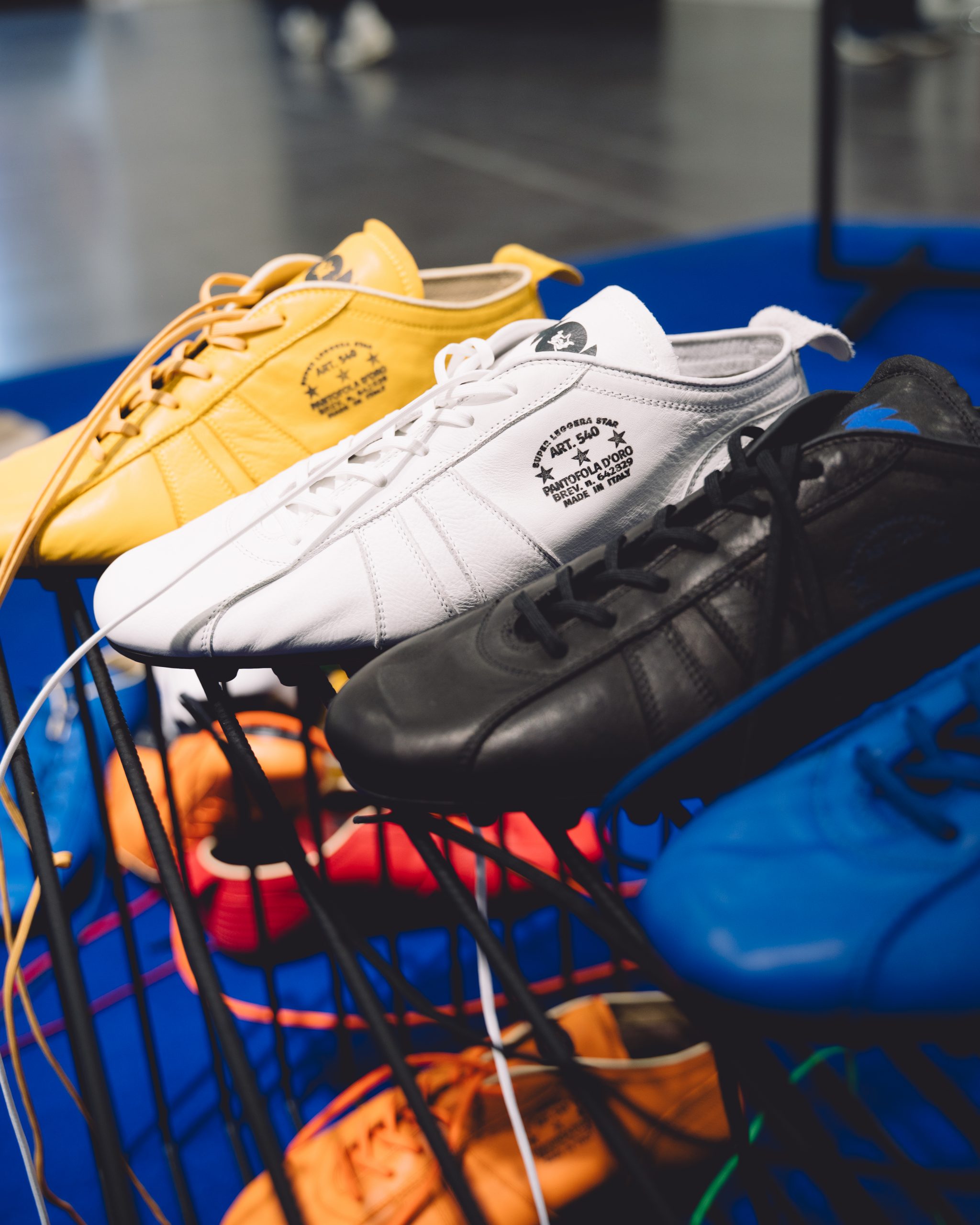 Pantofola d'Oro boots styled with premium dark denim and tailored trousers.