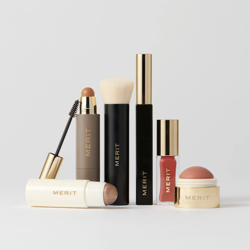 A collection of minimalist makeup and skincare bottles.