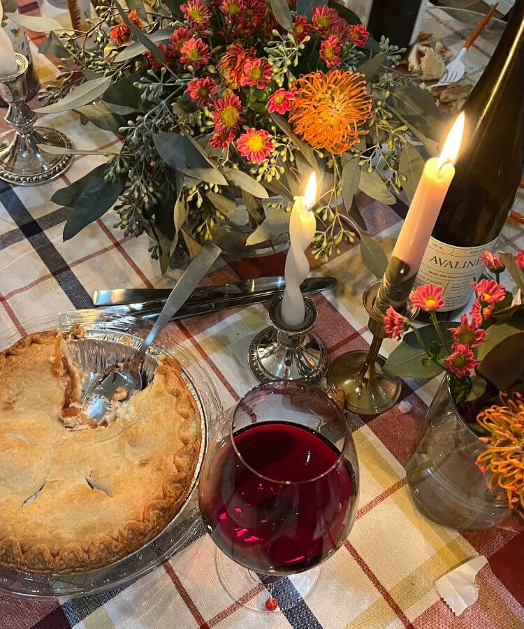 Flatlay of a November calendar with a cup of coffee and a cozy knit sweater.