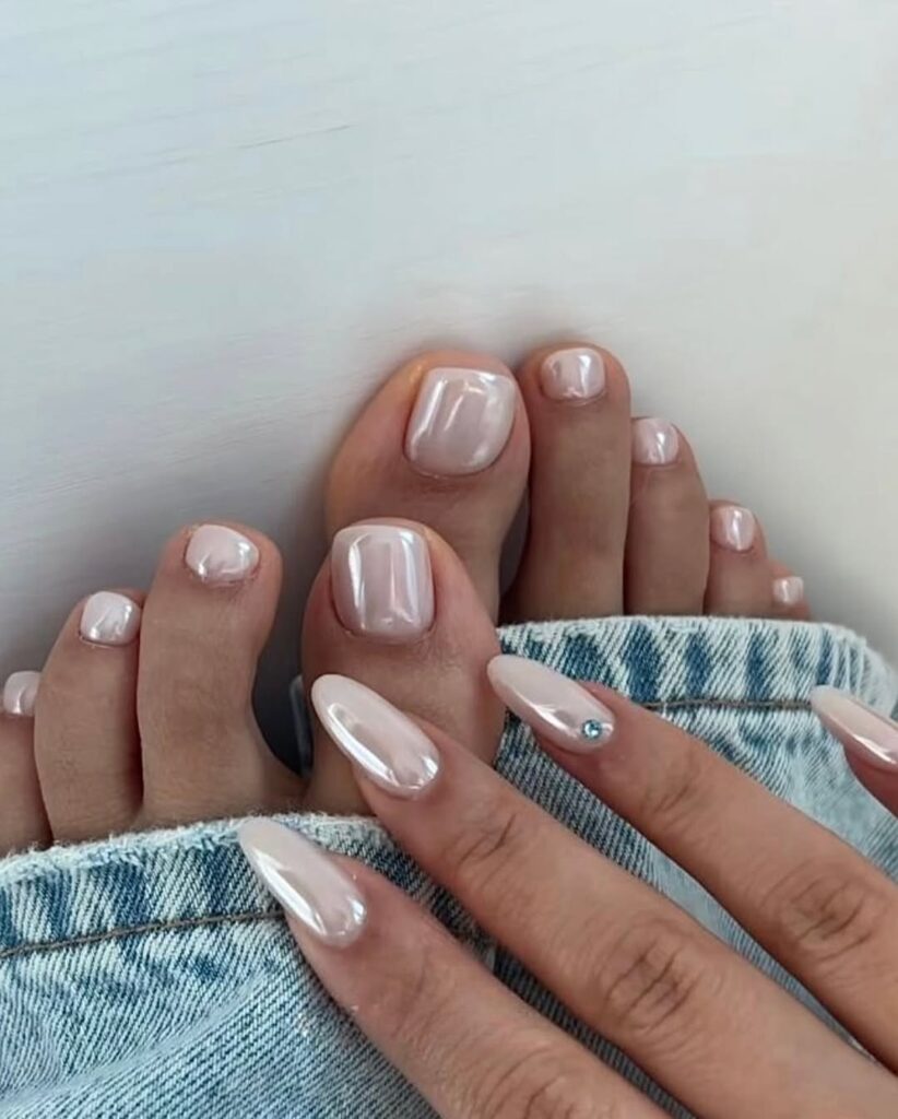 Chrome French tip pedicure with metallic silver edges.