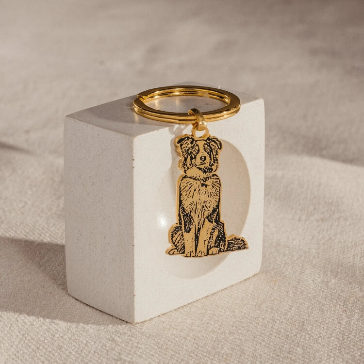 A custom keychain featuring a silhouette of a pet's face.