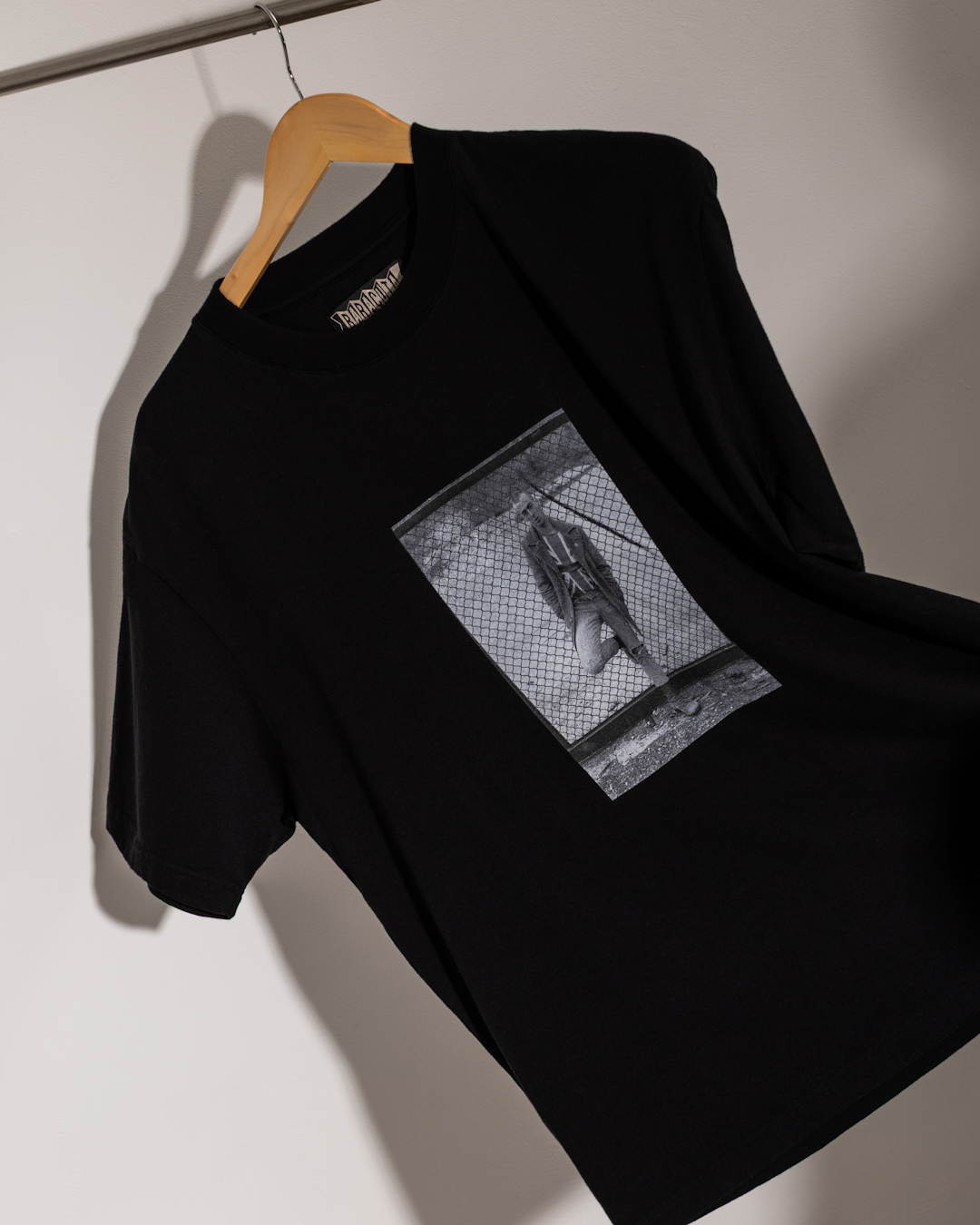 Lifestyle shot of the Baracuta x Gavin Watson collection in a gritty UK urban environment.