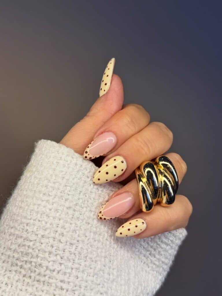 Elegant French tip nails with butter yellow polish.