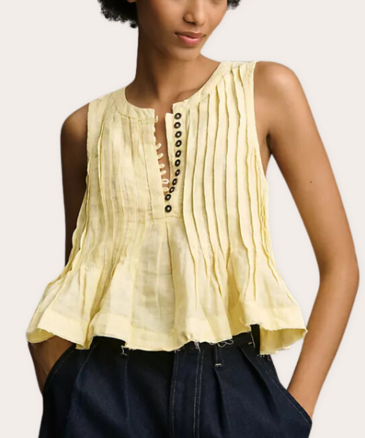 A yellow sleeveless flouncy tank top from Anthropologie.