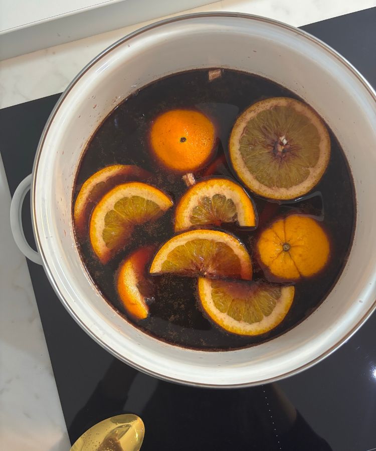 Cozy winter interior featuring soft blankets and warm ambient lighting.