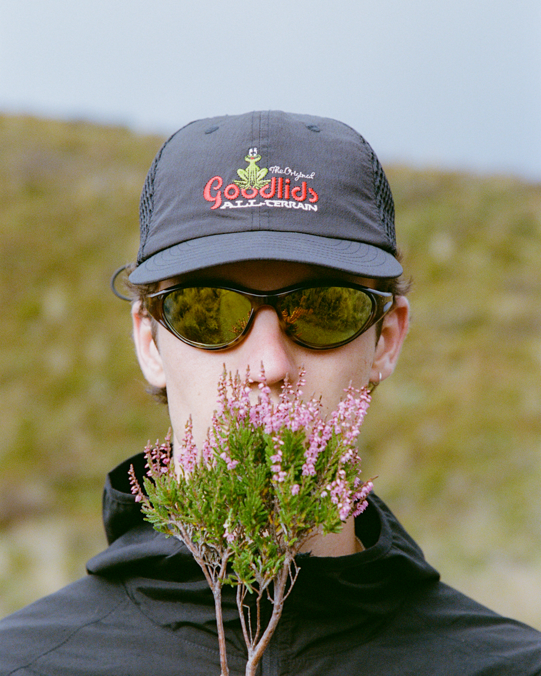A wide-angle scenic view of the national park featuring models in the distance wearing the SS26 drop.