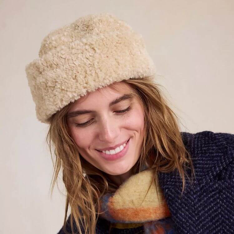 A structured fisherman style hat in a neutral fabric.