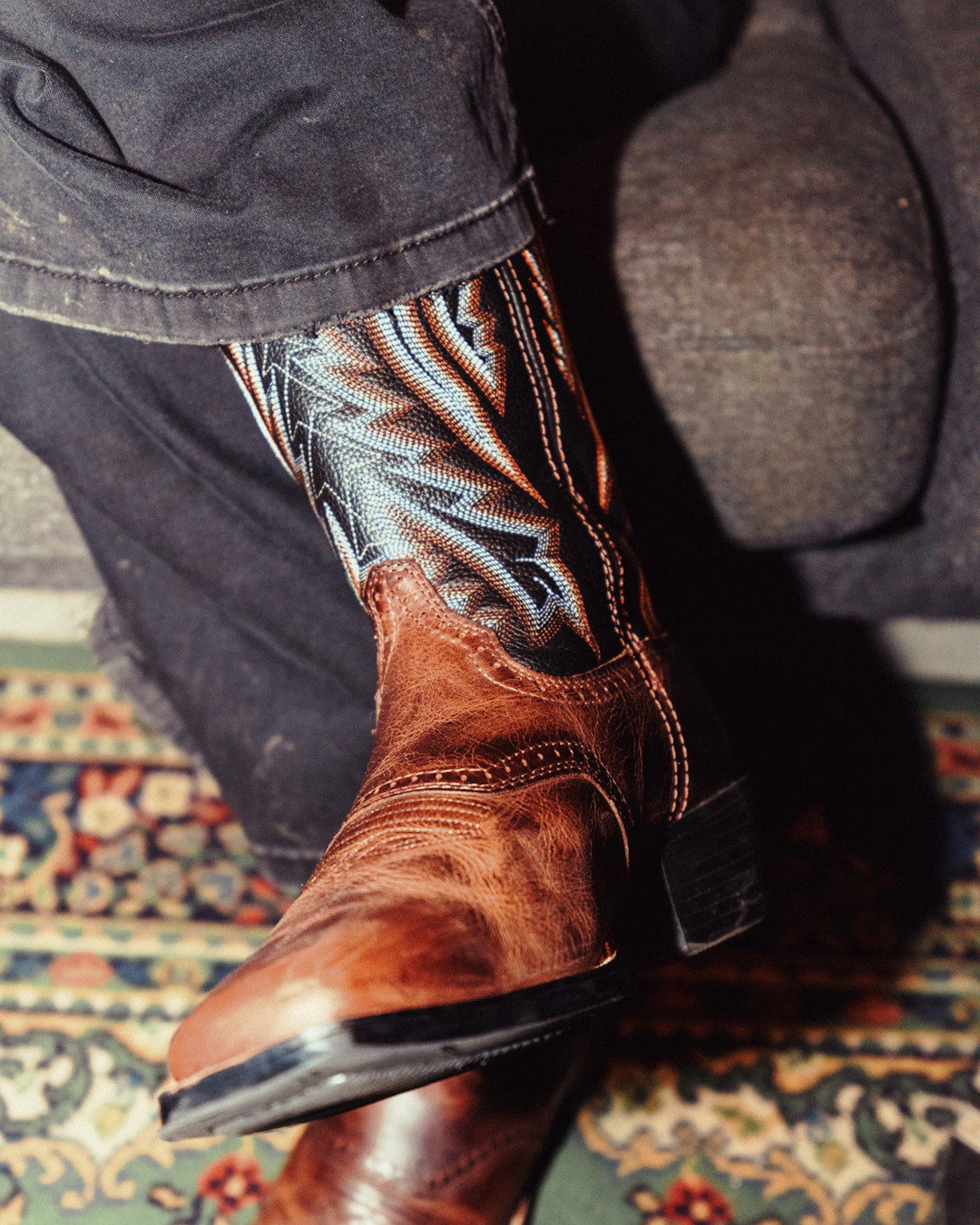 Full-length lifestyle shot of a complete western wear outfit in motion.