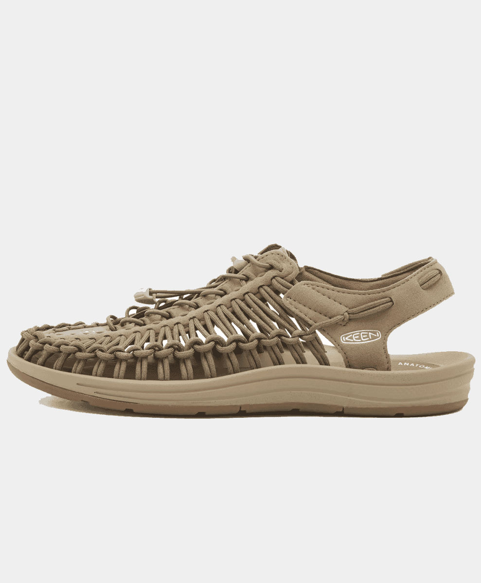 Side profile of a beige KEEN woven sandal against a white background.