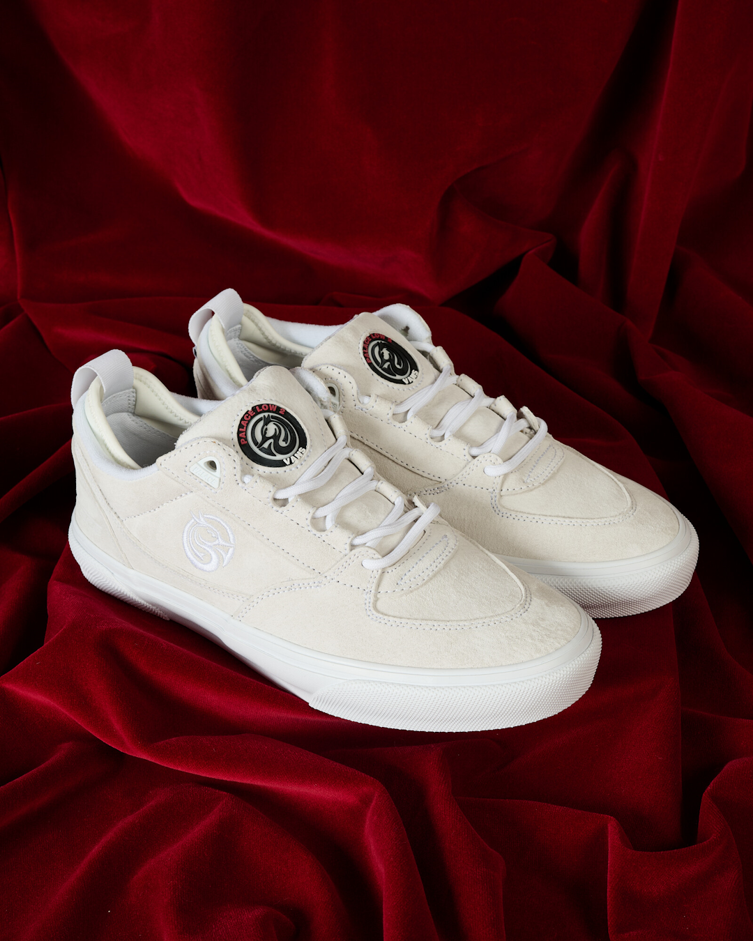 Lifestyle shot of a skater wearing the Vans Low 2 and Palace apparel in an urban environment.